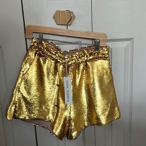 NWT Heidi Merrick Gold sequin shorts. Elastic waist. Perfect condition.